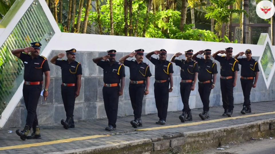 Mission 1st guard formation marching along a compound wall